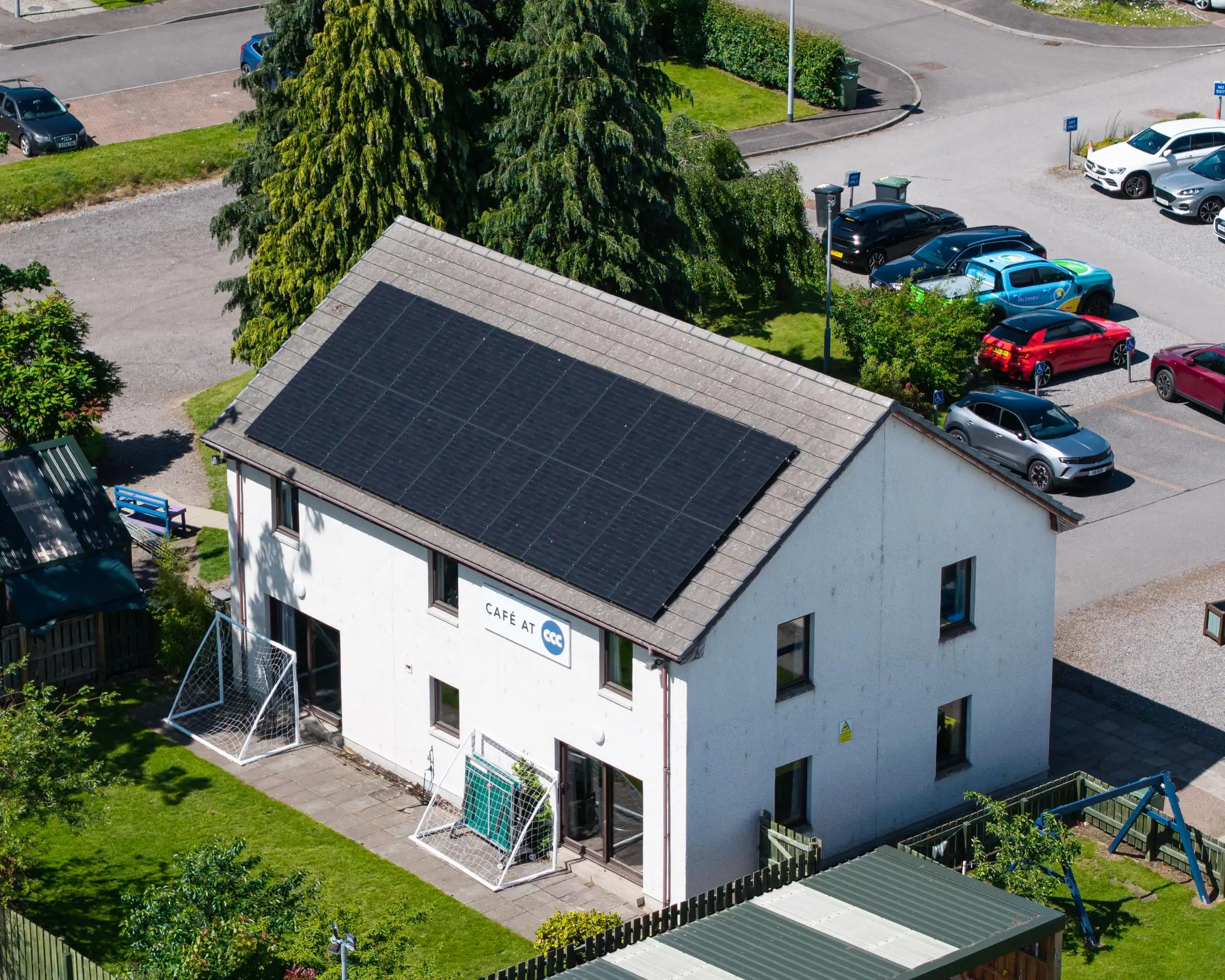 Aerial view of a rooftop solar panel array installed by McInnes Group in Scotland